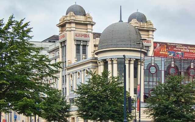 View of the classical Alhambra Theatre facade in Bradford, England.