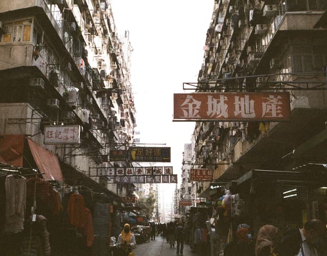 Explore the vibrant atmosphere of Sham Shui Po's street market in Hong Kong, capturing daily life and urban energy.