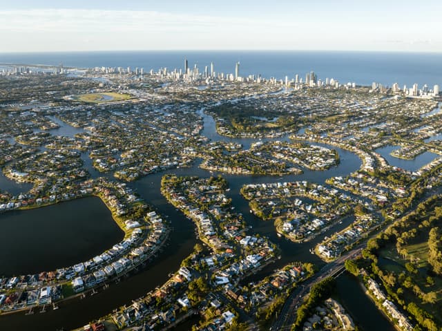Stunning aerial view of Clear Island Waters, showcasing urban landscape and waterways.