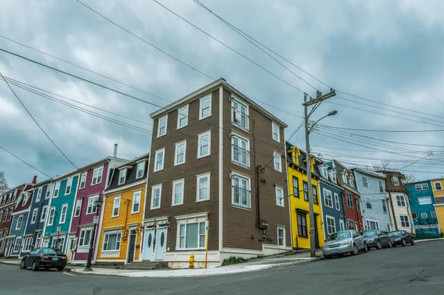 Charming street with colorful houses in an urban setting, ideal for travel or architecture themes.